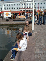 Beverley, Dave & Howard waiting for the ferry, City Hall behind