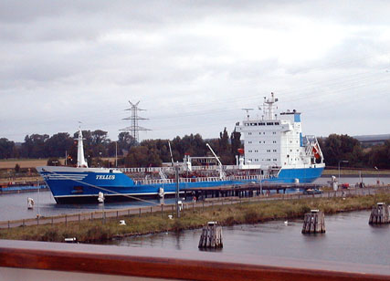 Ship alongside small port in the canal