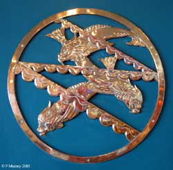 brass plaque with fish motif